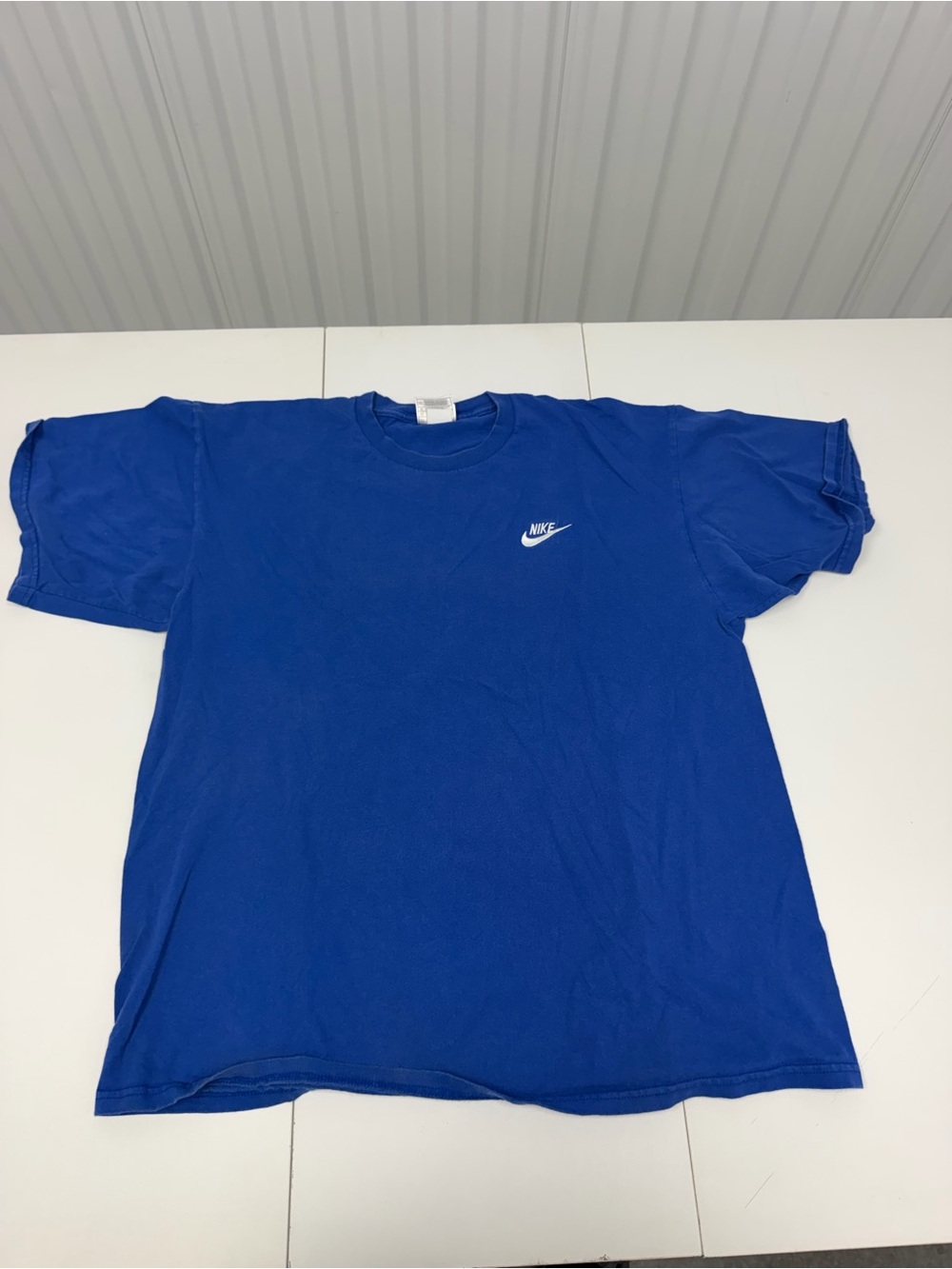 Vintage Nike Men's Blue Classic Logo T-Shirt